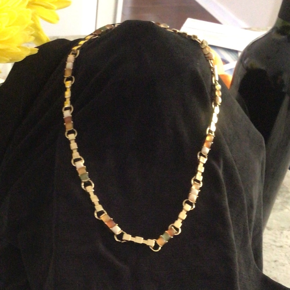 Necklace in goldtone, set with green pale, amber and cream 16.74”